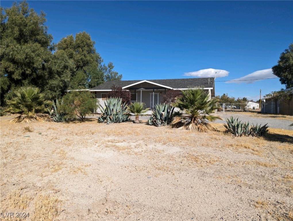 Front of home with dettached garage to side