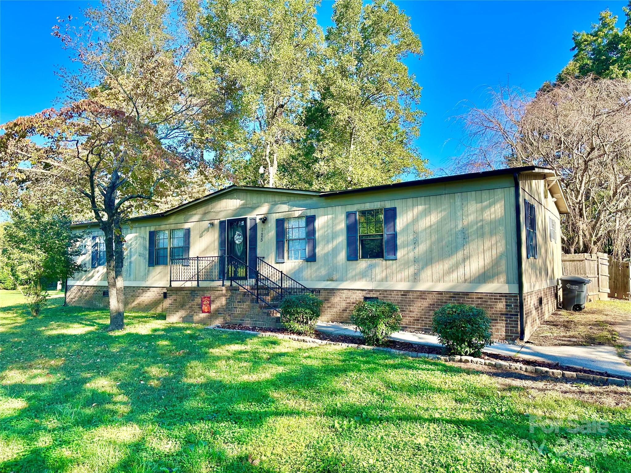 a view of a house with a yard porch and sitting area