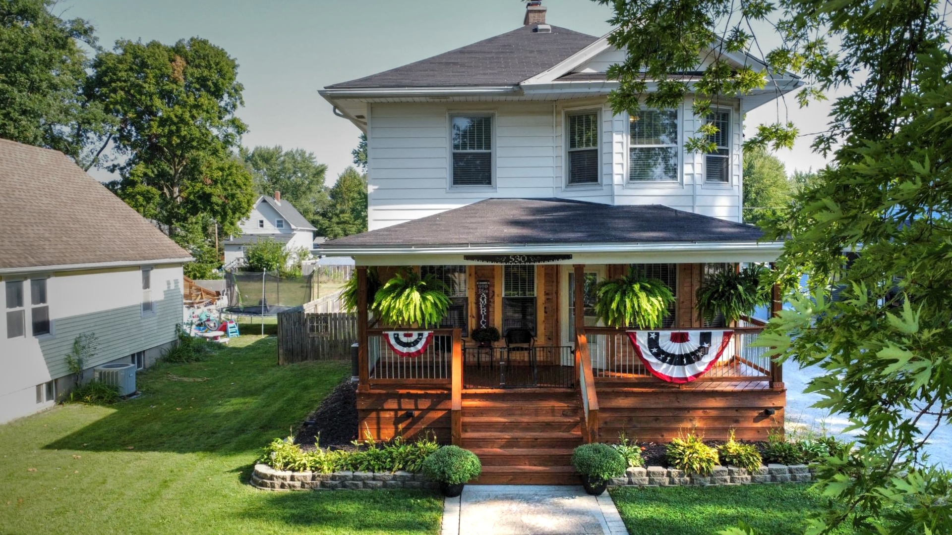 a front view of a house with garden