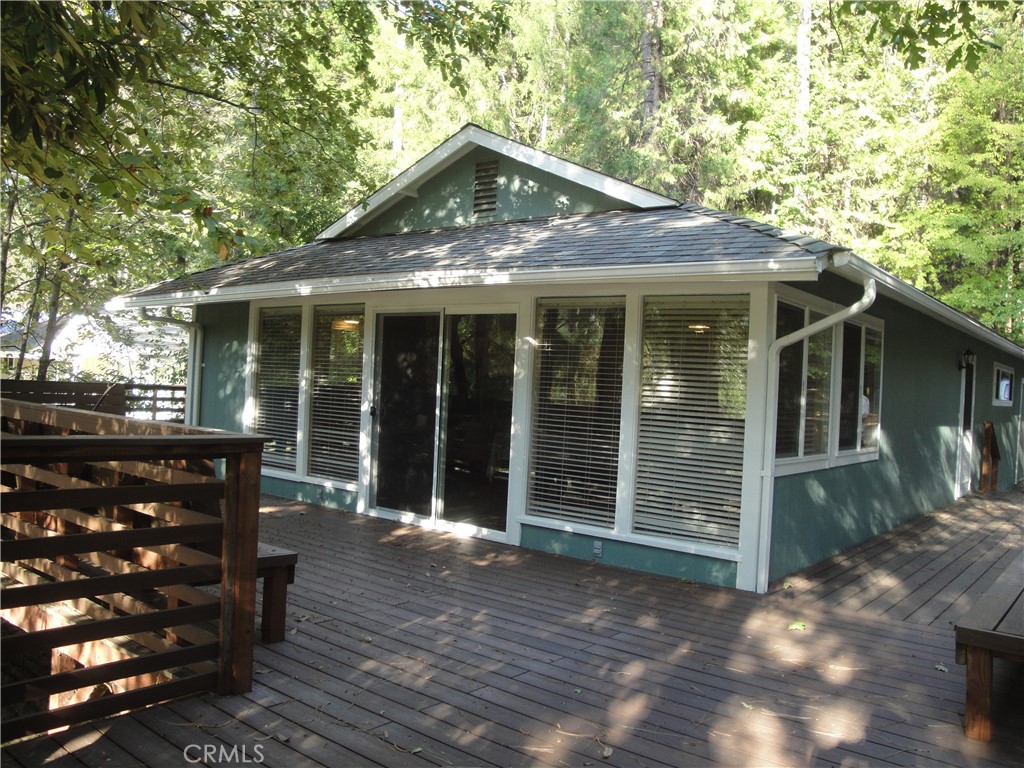 a front view of house with a garden