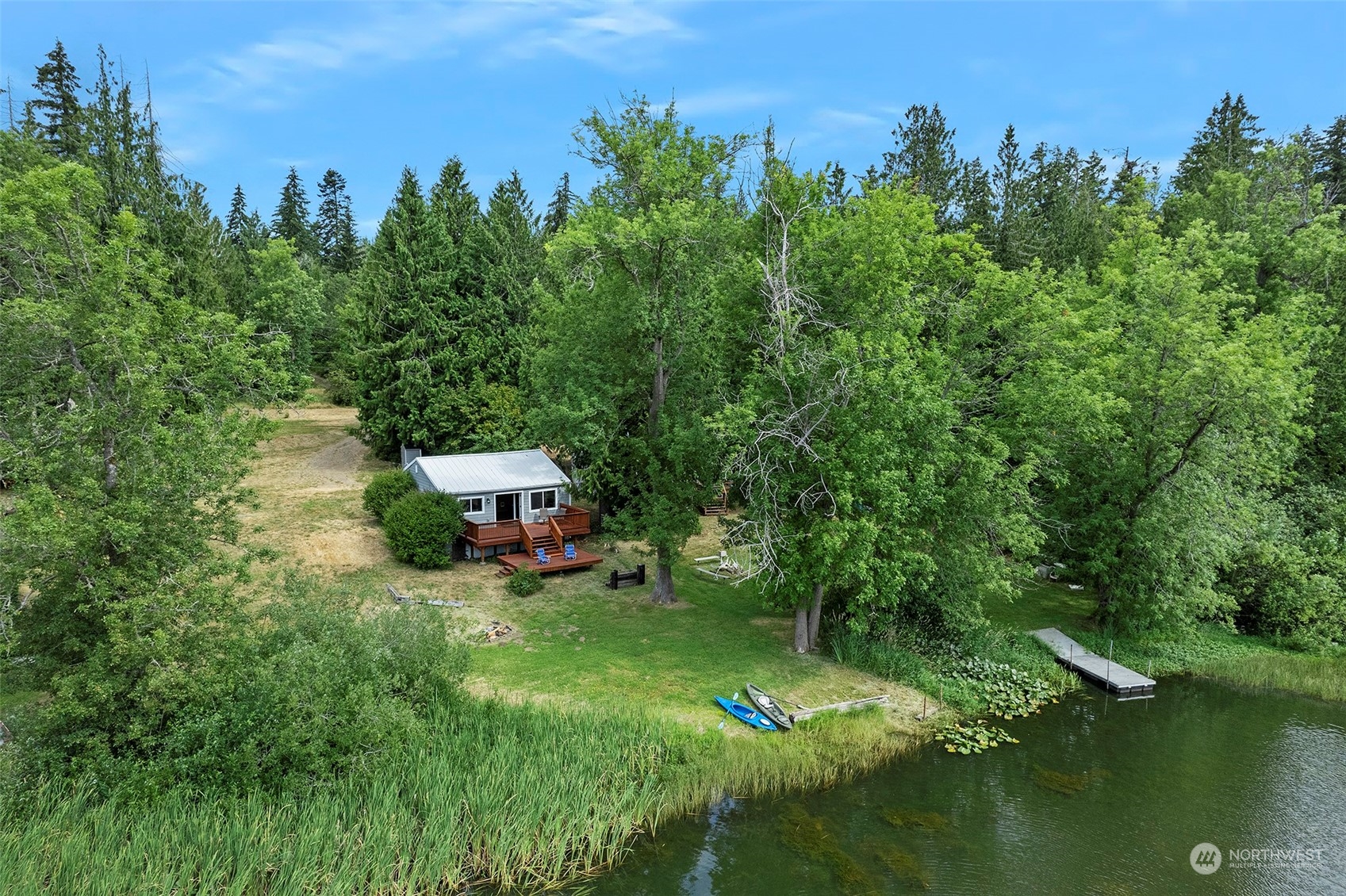 a backyard of a house with yard and lake view