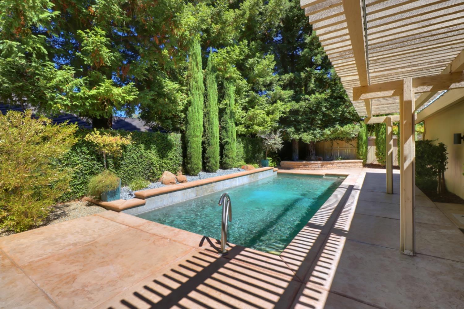 a view of a backyard with sitting area