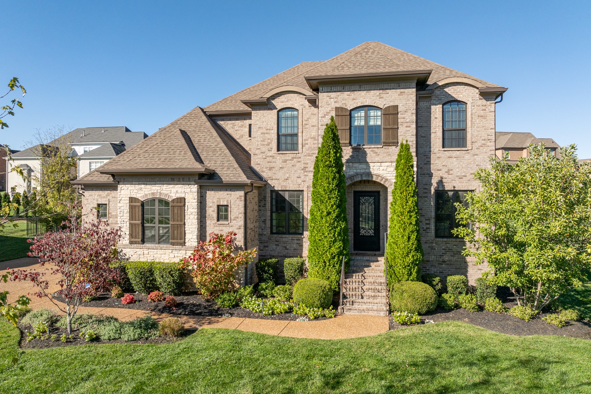 a front view of a house with a yard