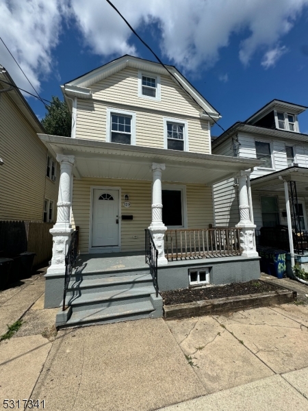 a front view of house with stairs