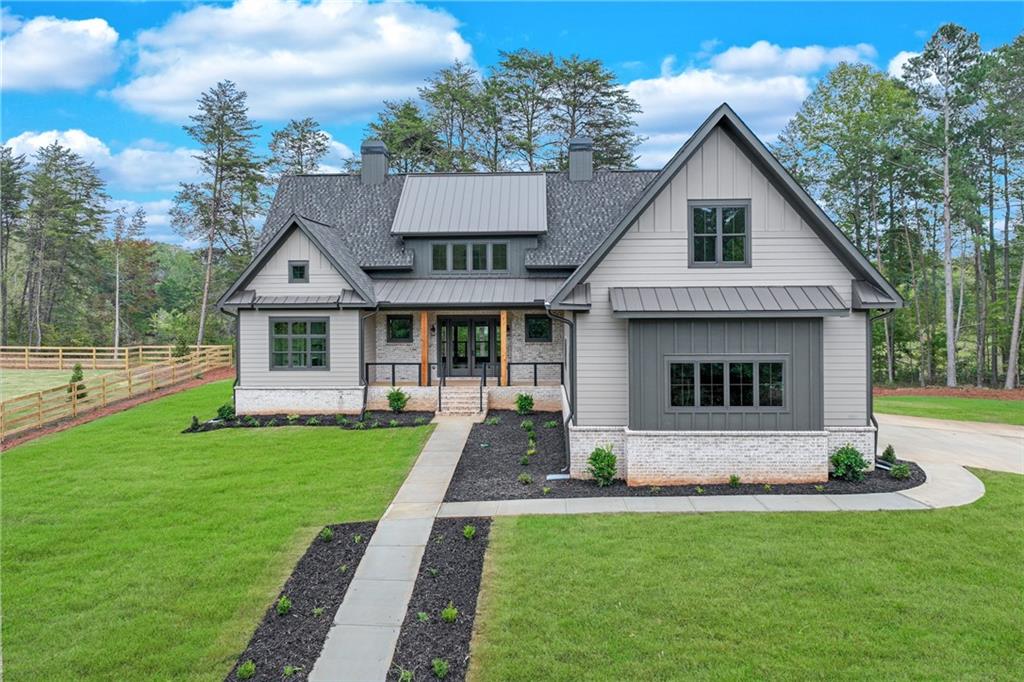 a front view of a house with a yard