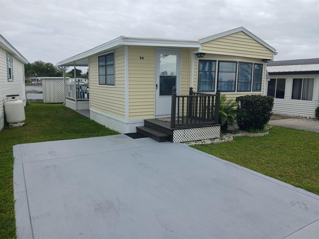 a view of a house with a back yard