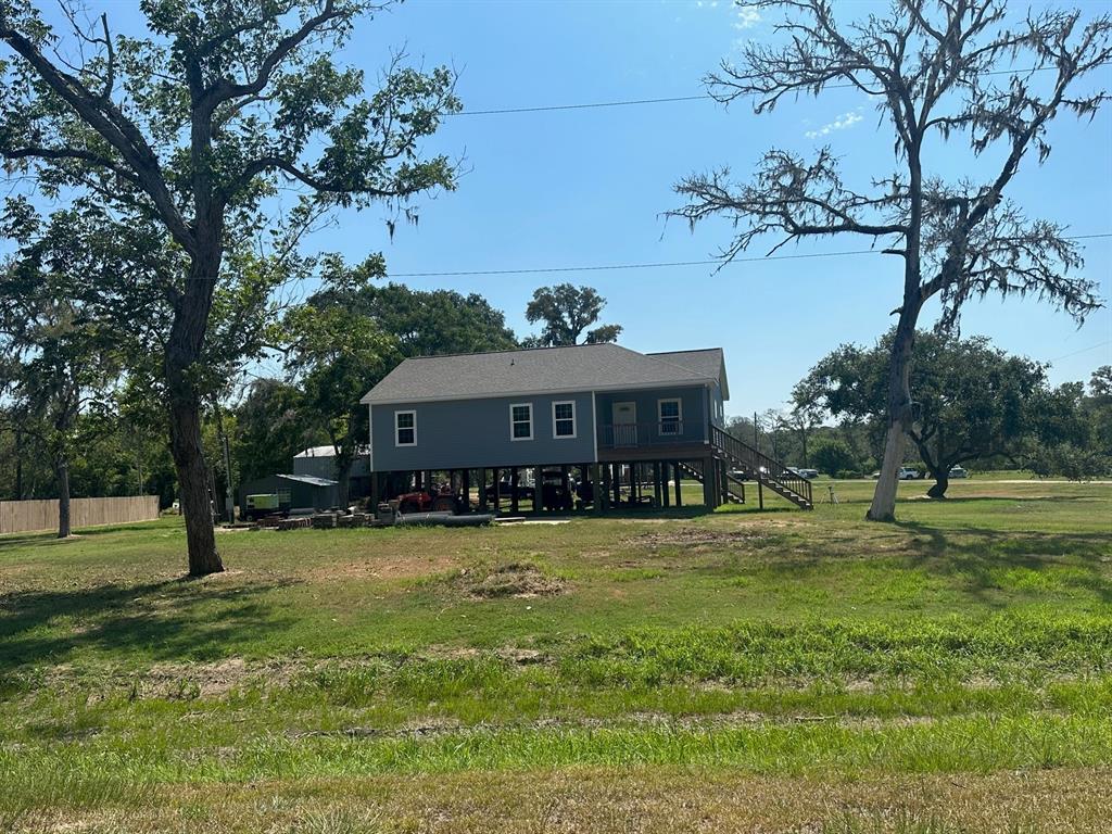 a view of a house with a big yard