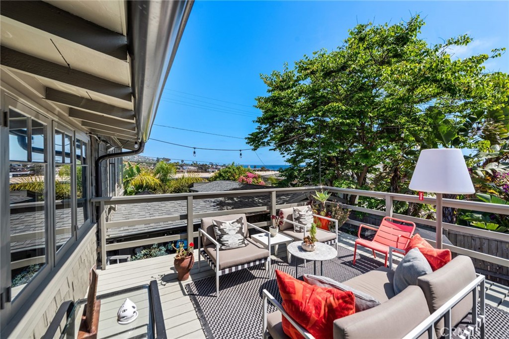 a outdoor living space with furniture and city view