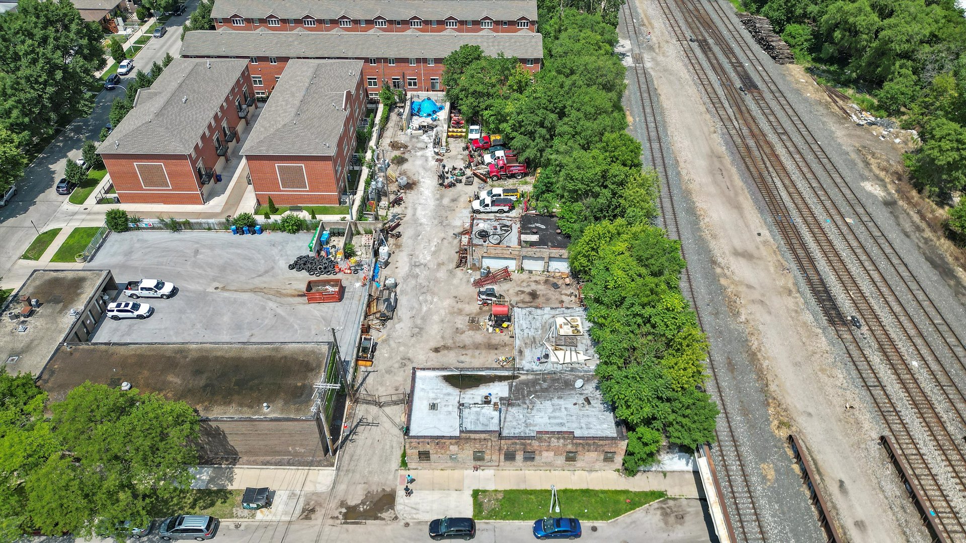 an aerial view of residential houses with outdoor space