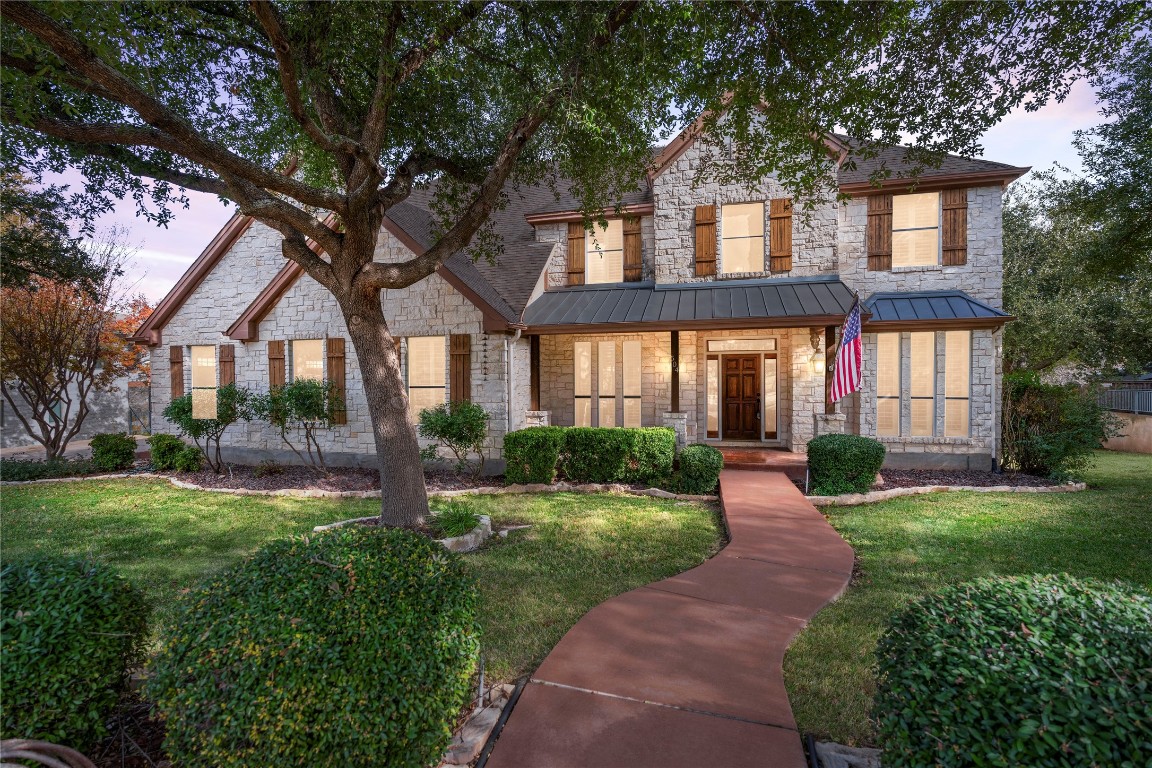 front view of a house with a yard