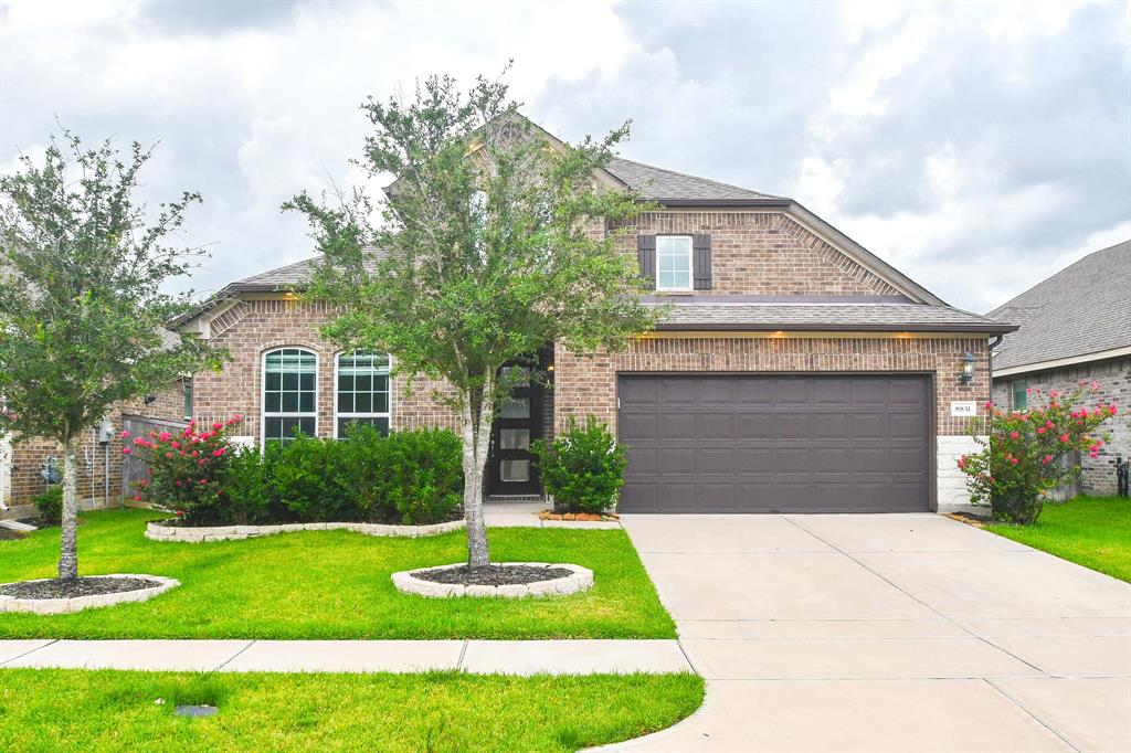 Welcome to a modern single-family home at 8831 Arch Rock in Cypress!