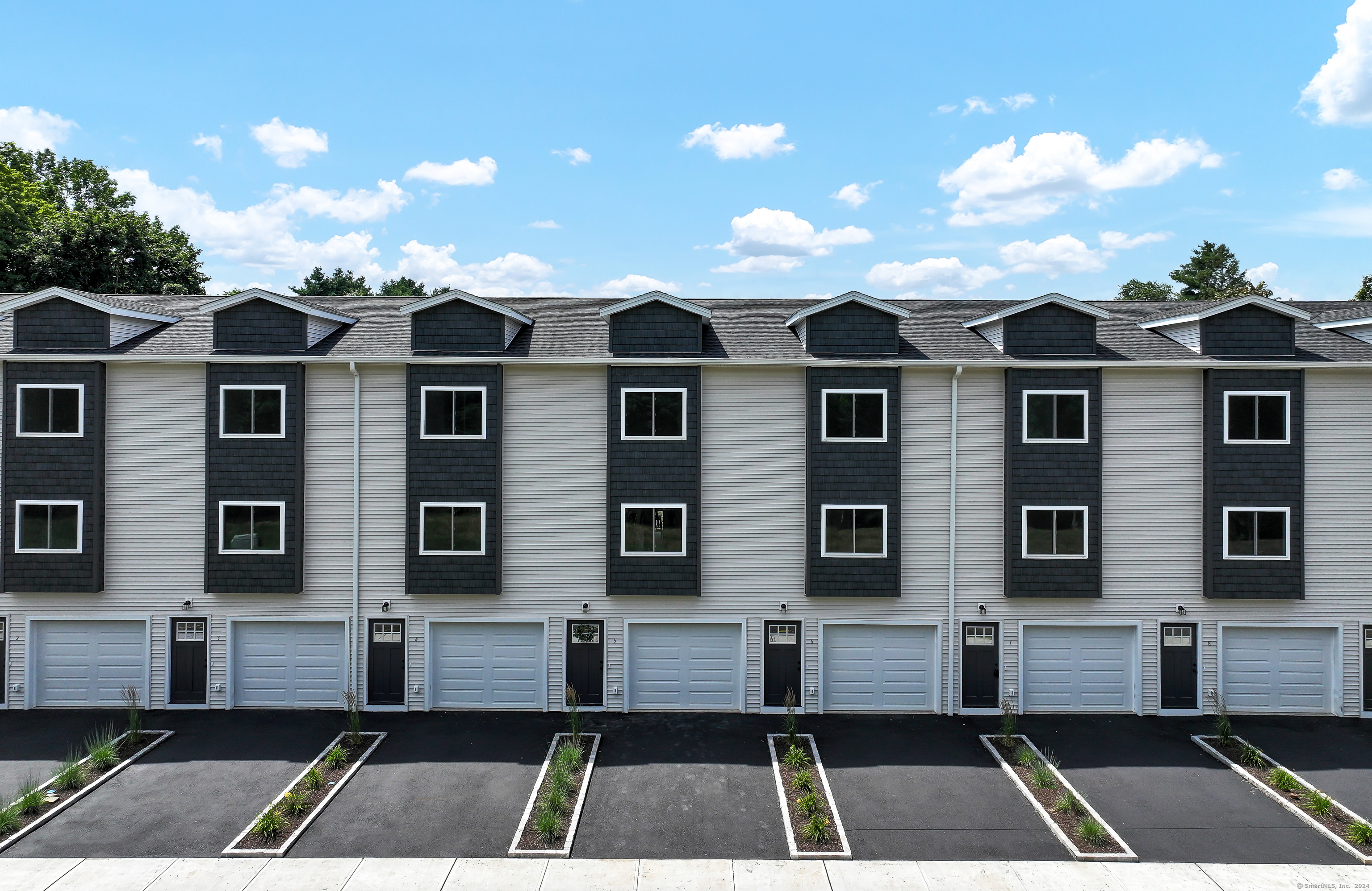 a view of a large building with a yard