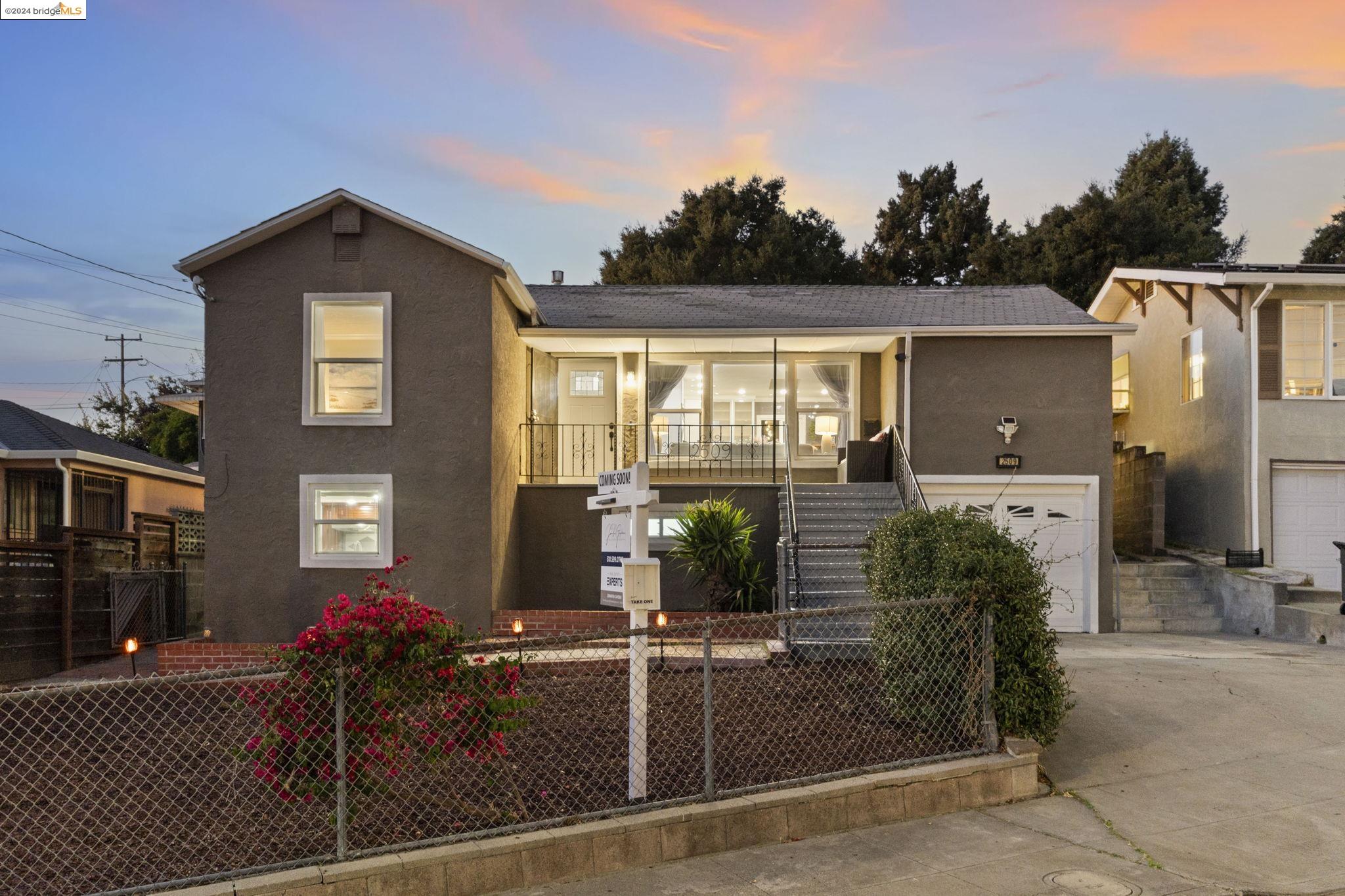 a front view of a house with parking