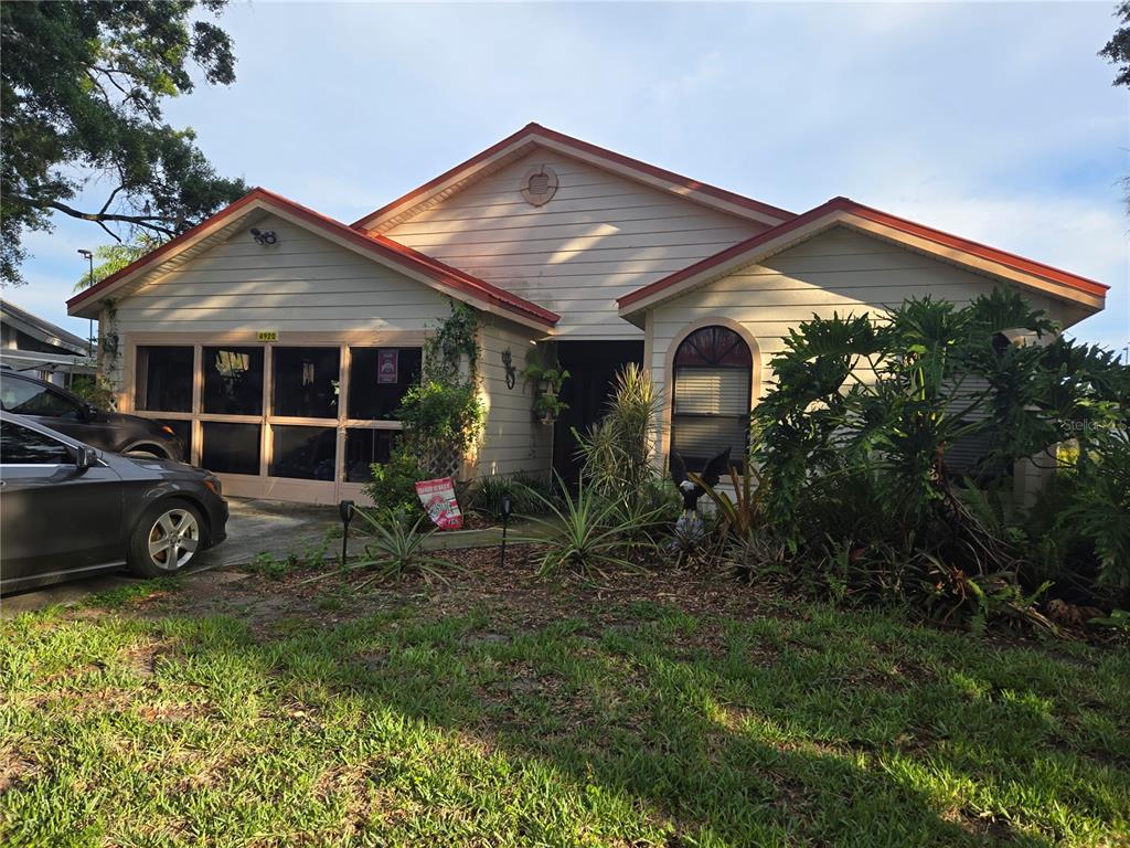 a front view of a house with garden