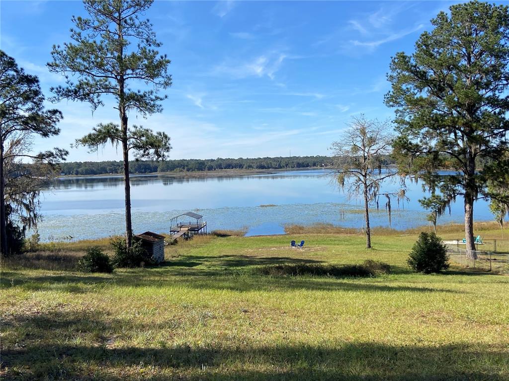 a view of a lake with a big yard