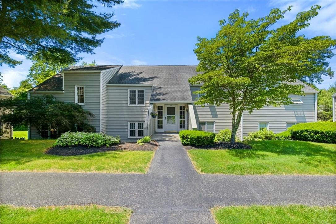 View of front of property with a front lawn