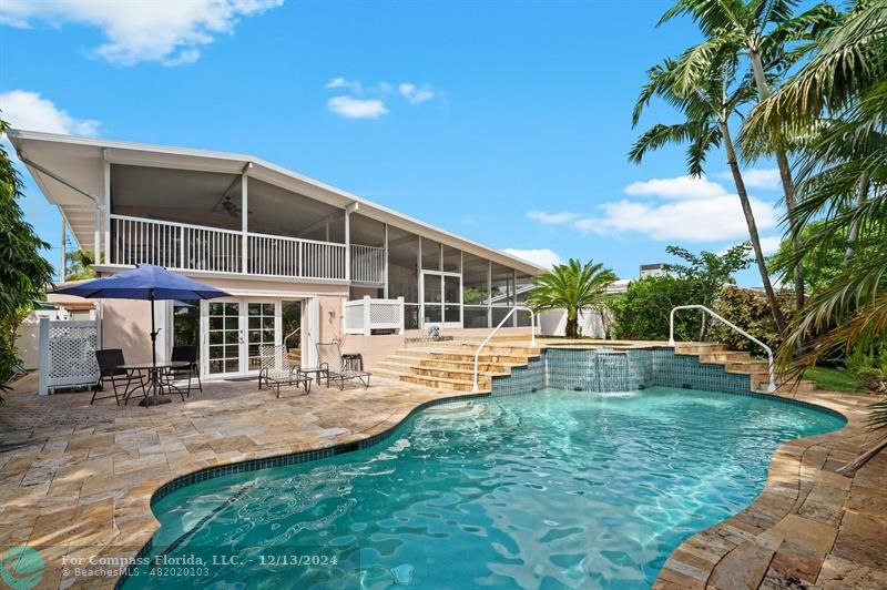 a view of a house with a yard patio and sitting area