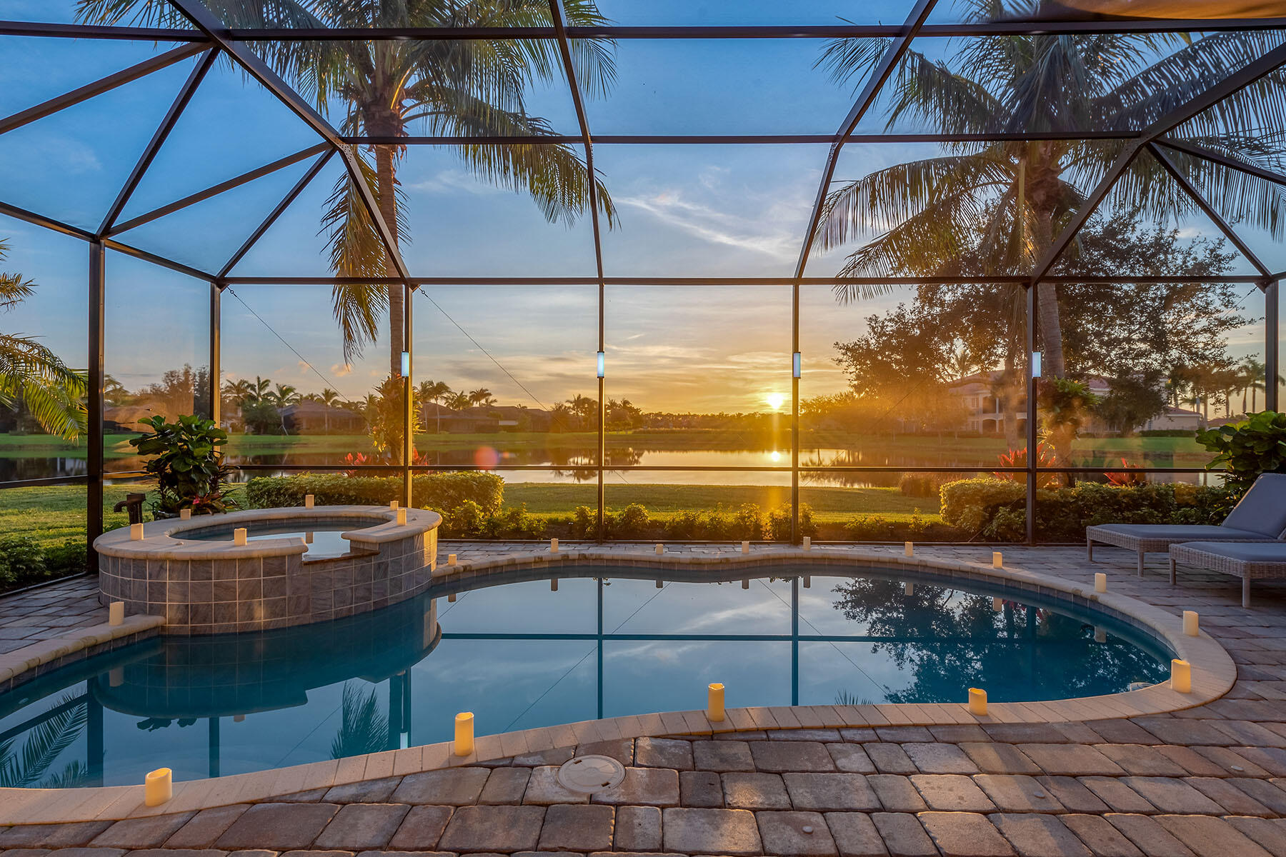 a view of a swimming pool with a lounge chairs