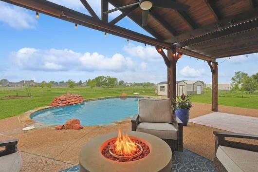 a view of swimming pool with a patio