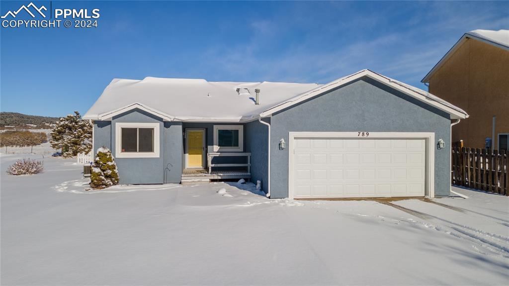 a view of a house with a garage