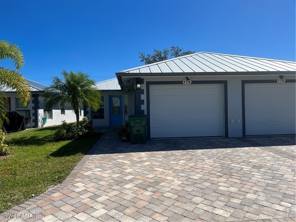 a front view of house with a yard