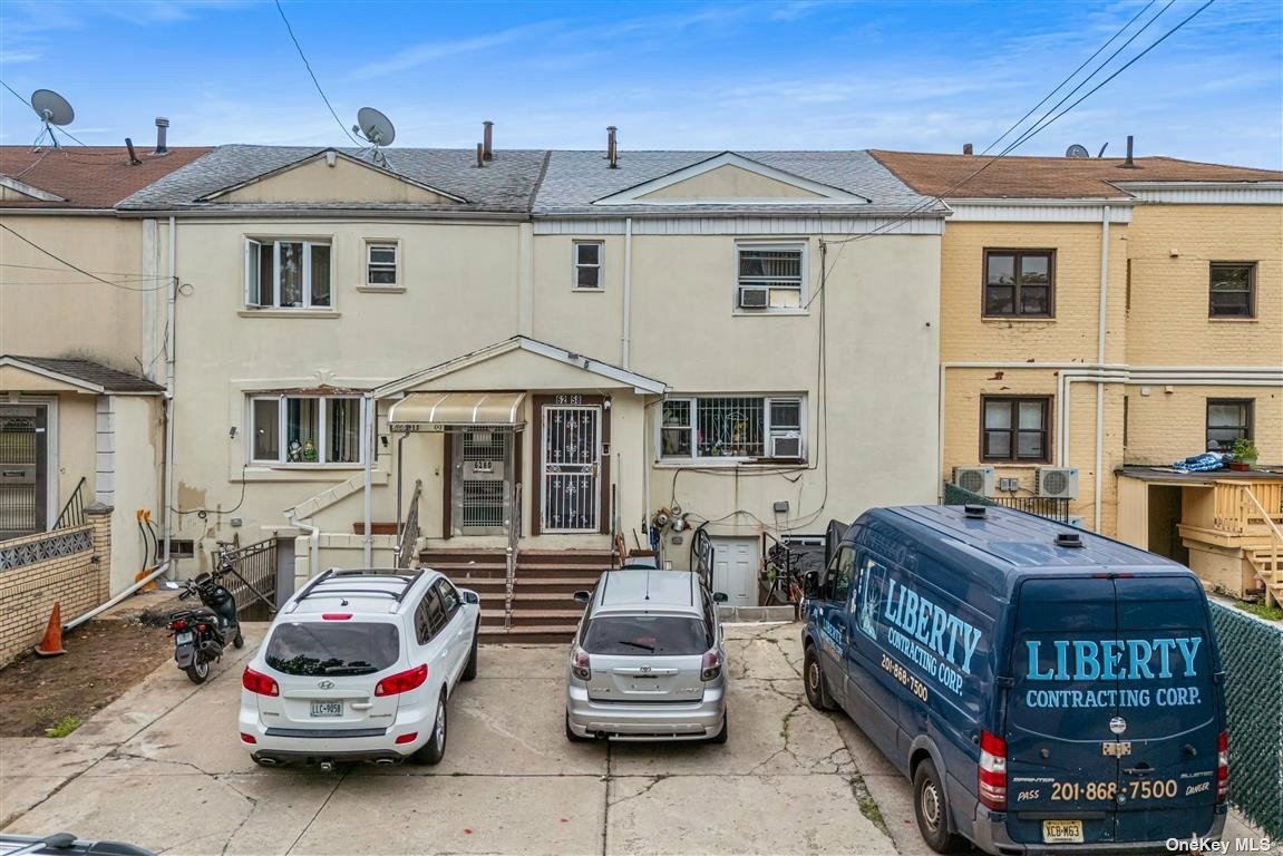 a front view of a house with parking