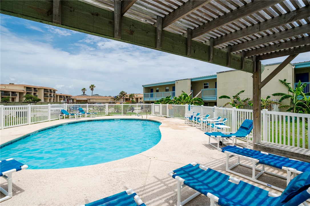 a view of a swimming pool with a patio