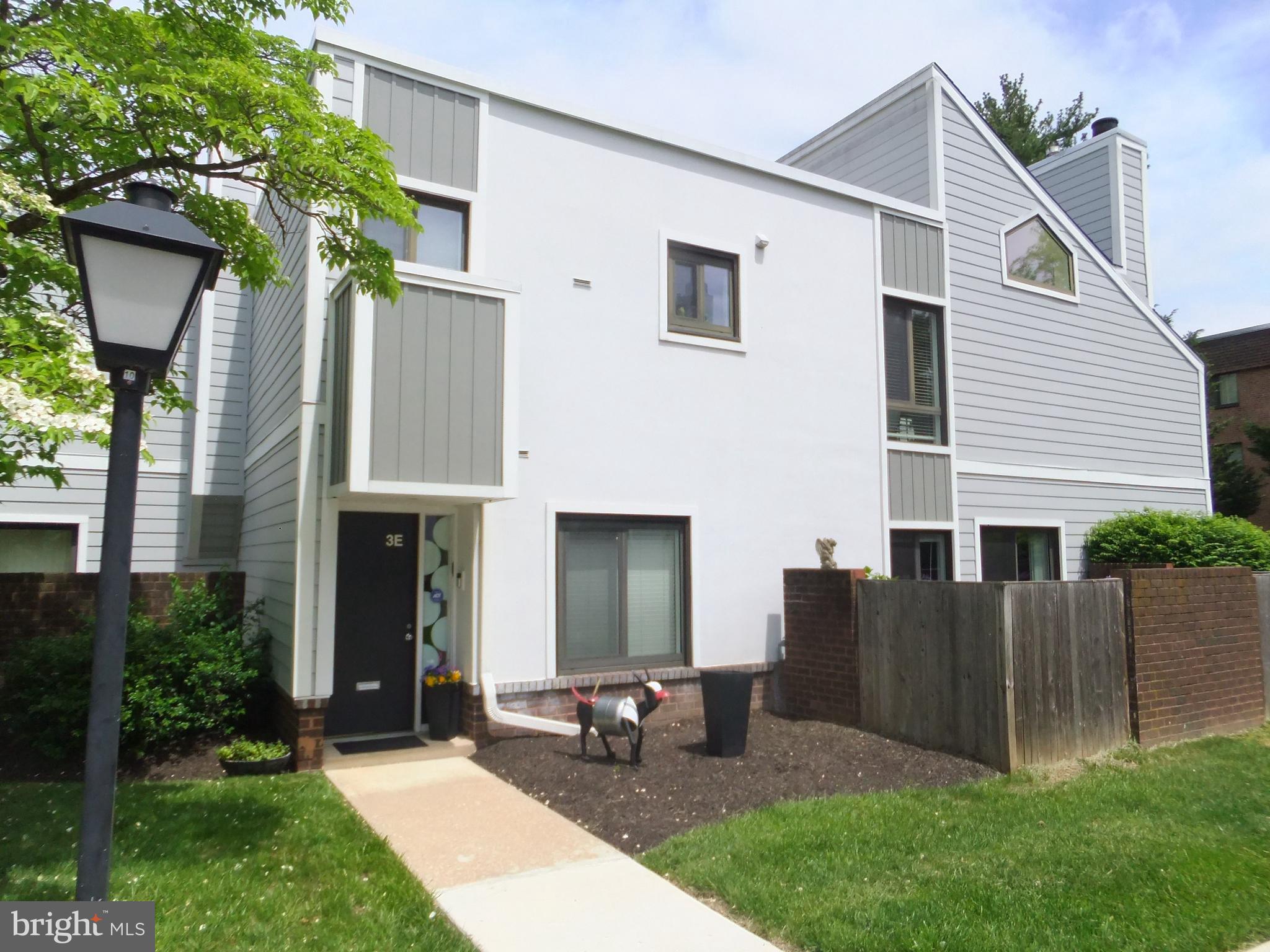 a front view of house with yard and outdoor seating