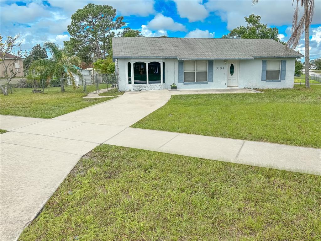 a front view of a house with yard