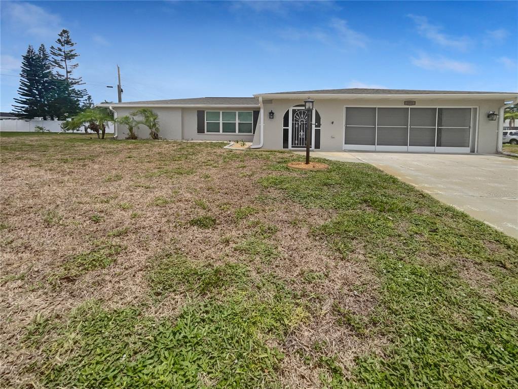 a view of a house with a yard