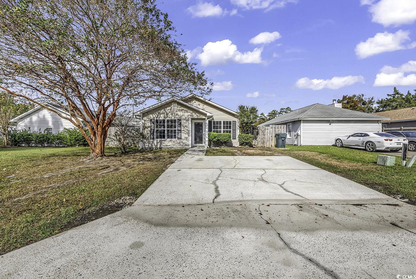 Single story home featuring a front yard