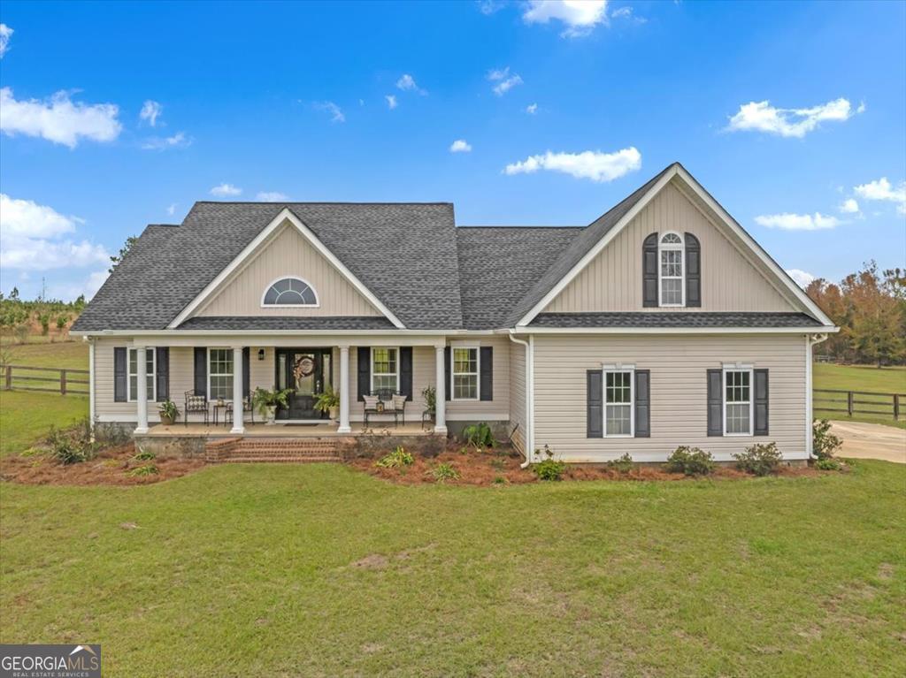 a front view of a house with a yard