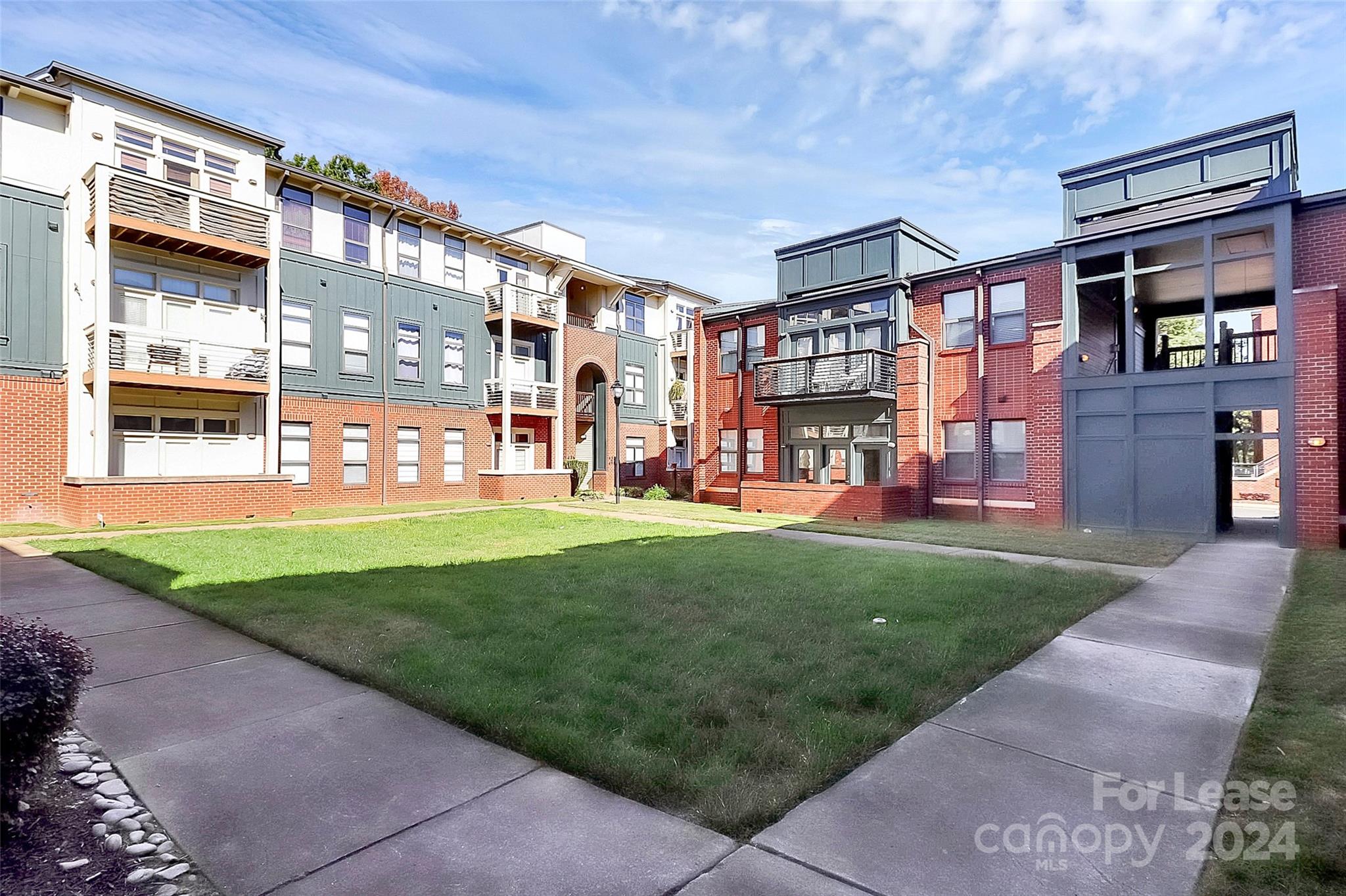 a view of a building with a yard