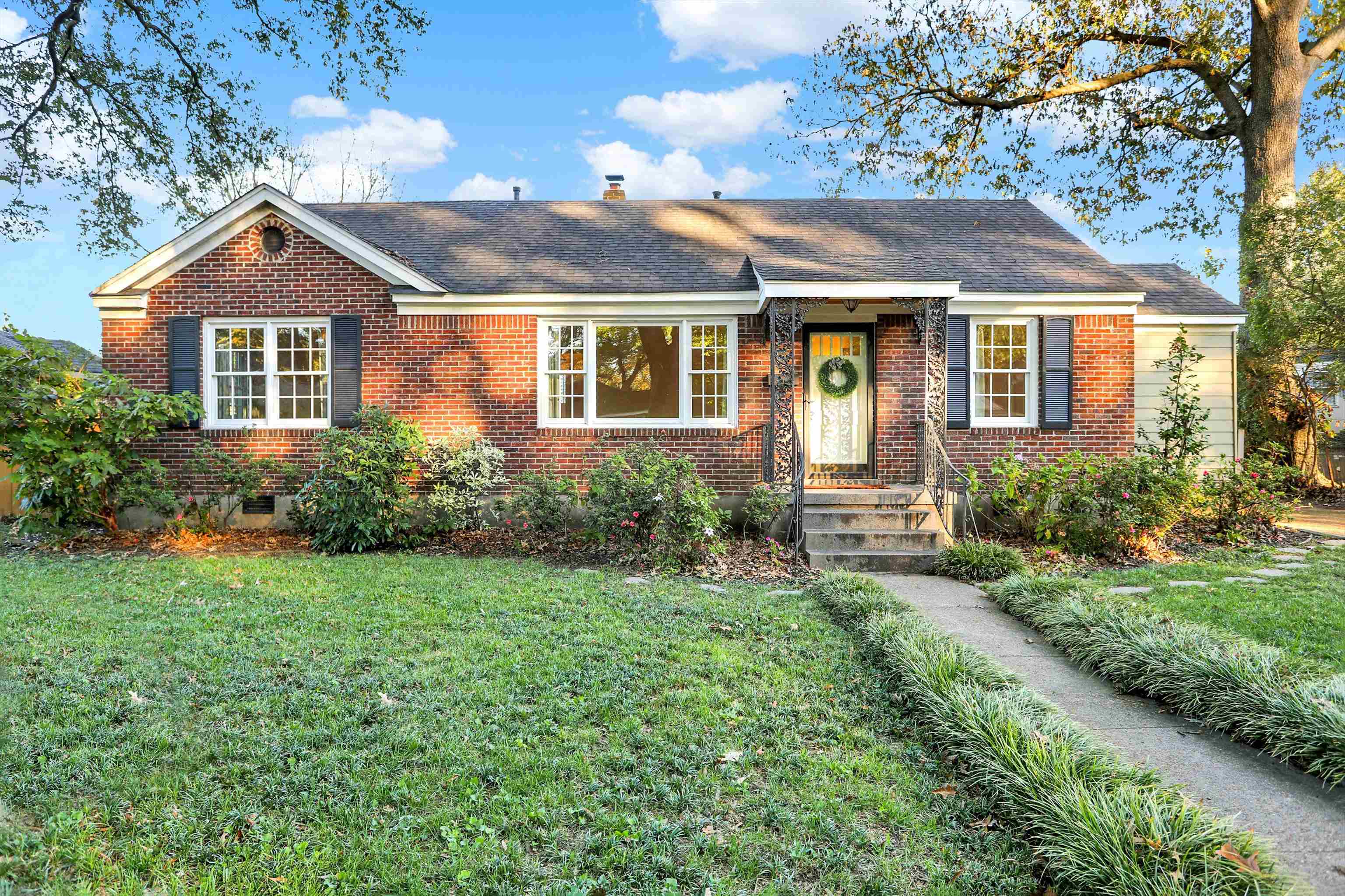 a front view of a house with a yard