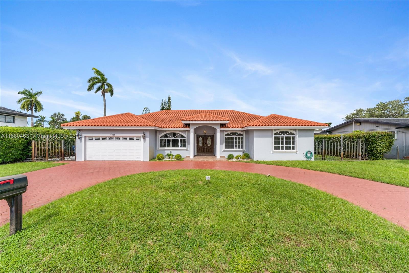 a front view of house with yard and outdoor seating