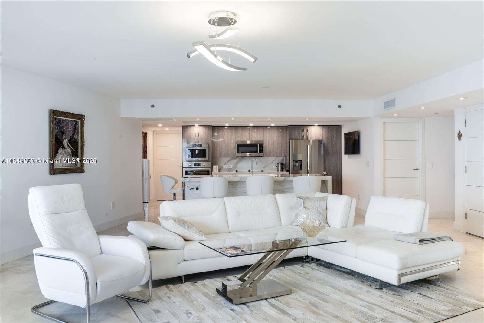 a living room with furniture and white walls