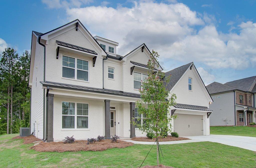 front view of a house with a yard