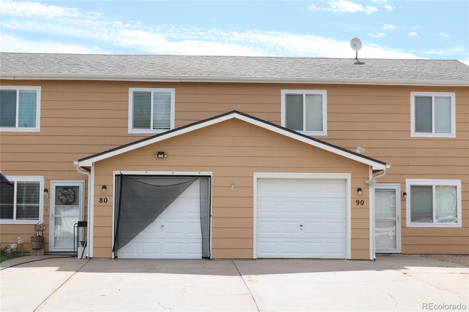 a front view of a house with a garage