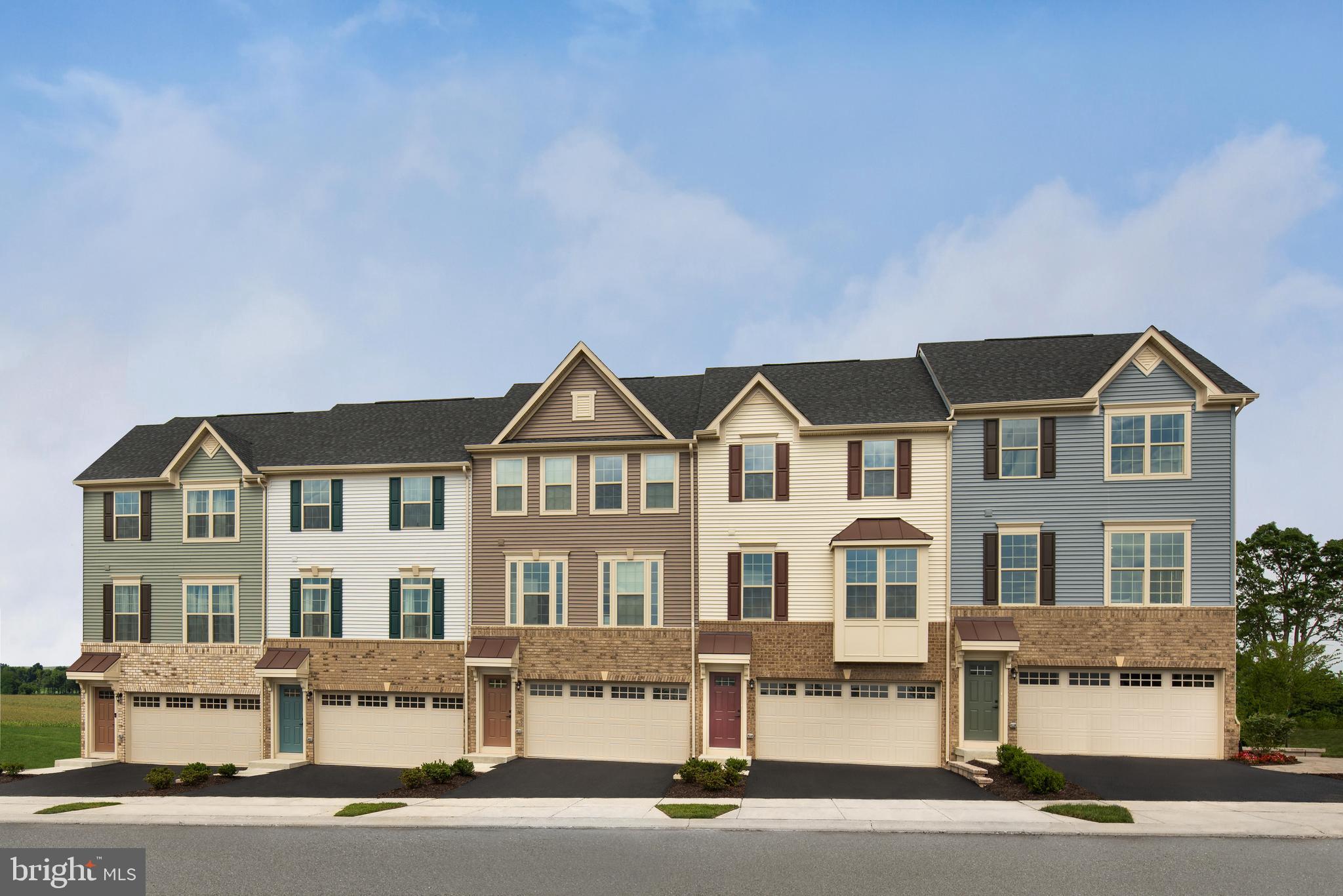 a front view of residential houses with street