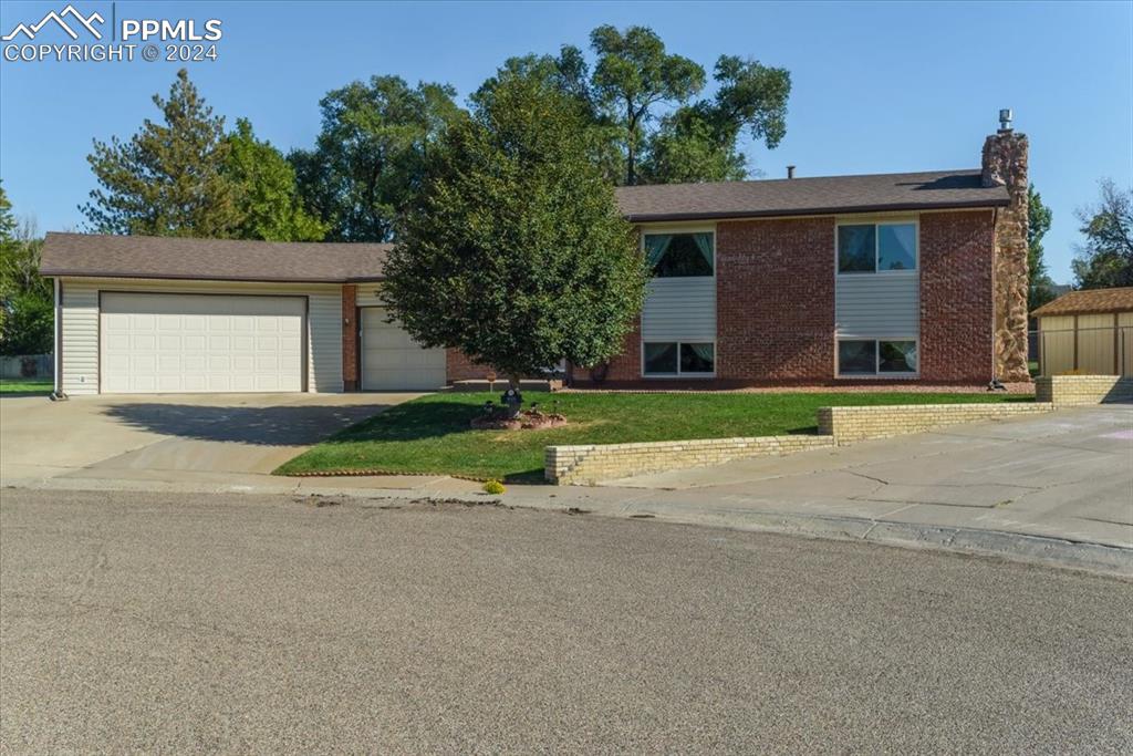 front view of a house with a yard