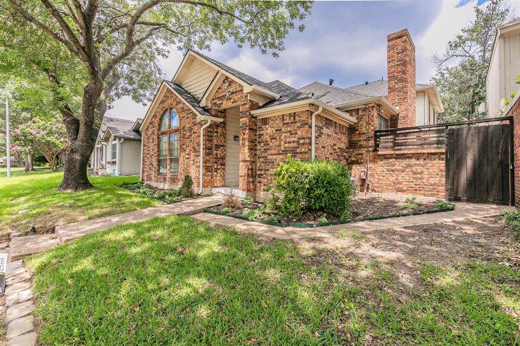 front view of a house with a big yard