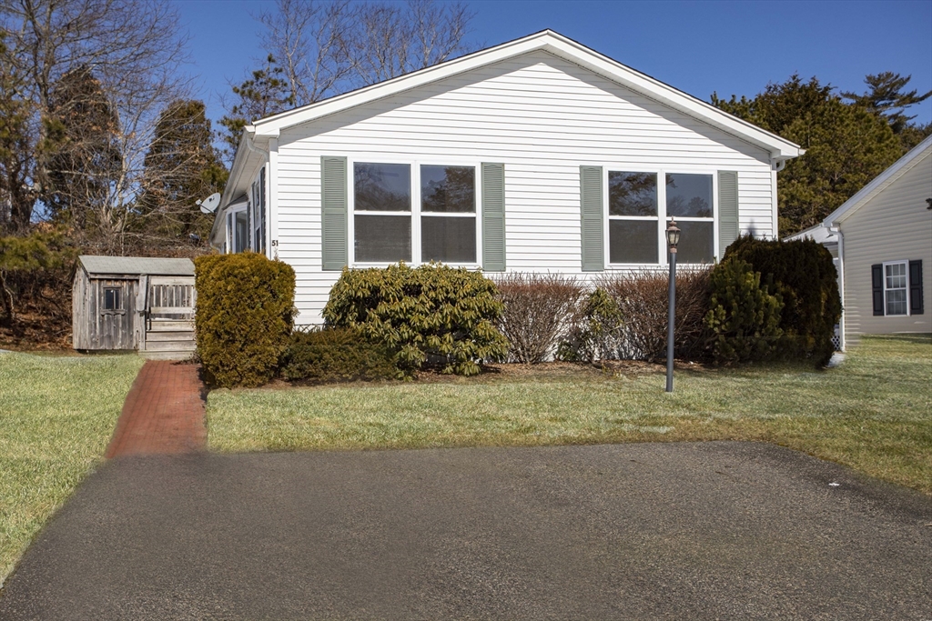 a house view with a garden space