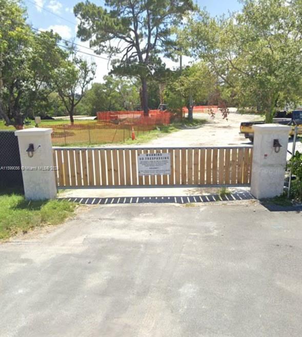 a view of a fence with a trees