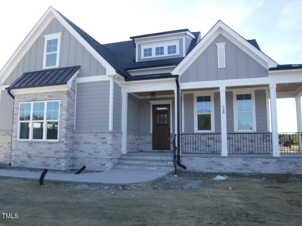 a front view of a house with garage