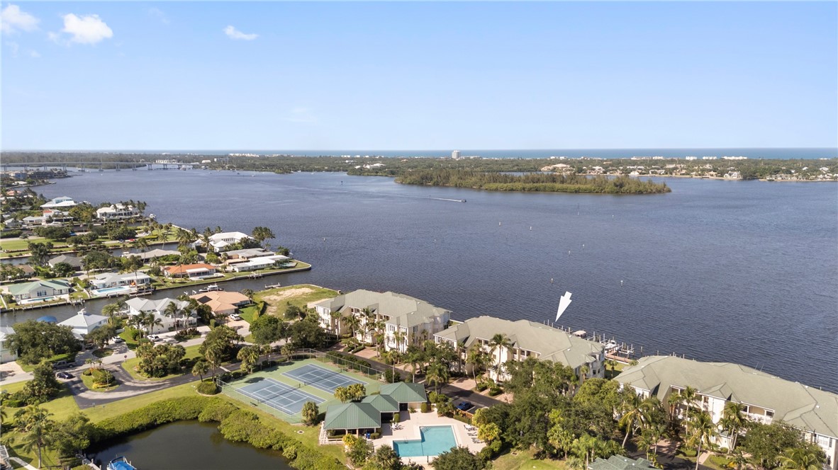 an aerial view of a house with a lake view