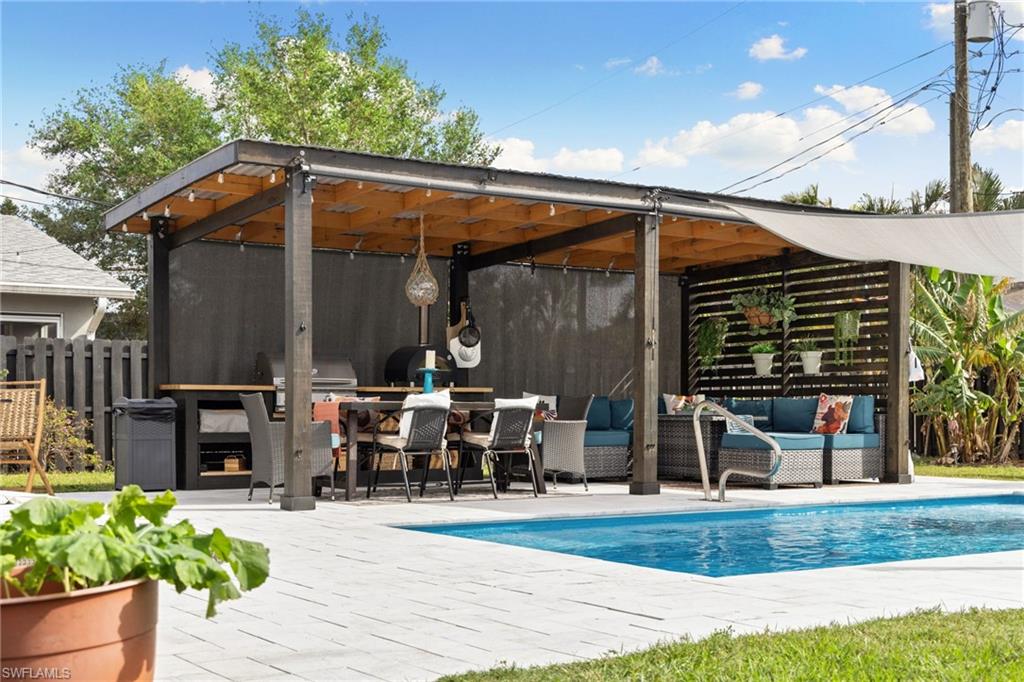 a view of a chair and tables in the patio