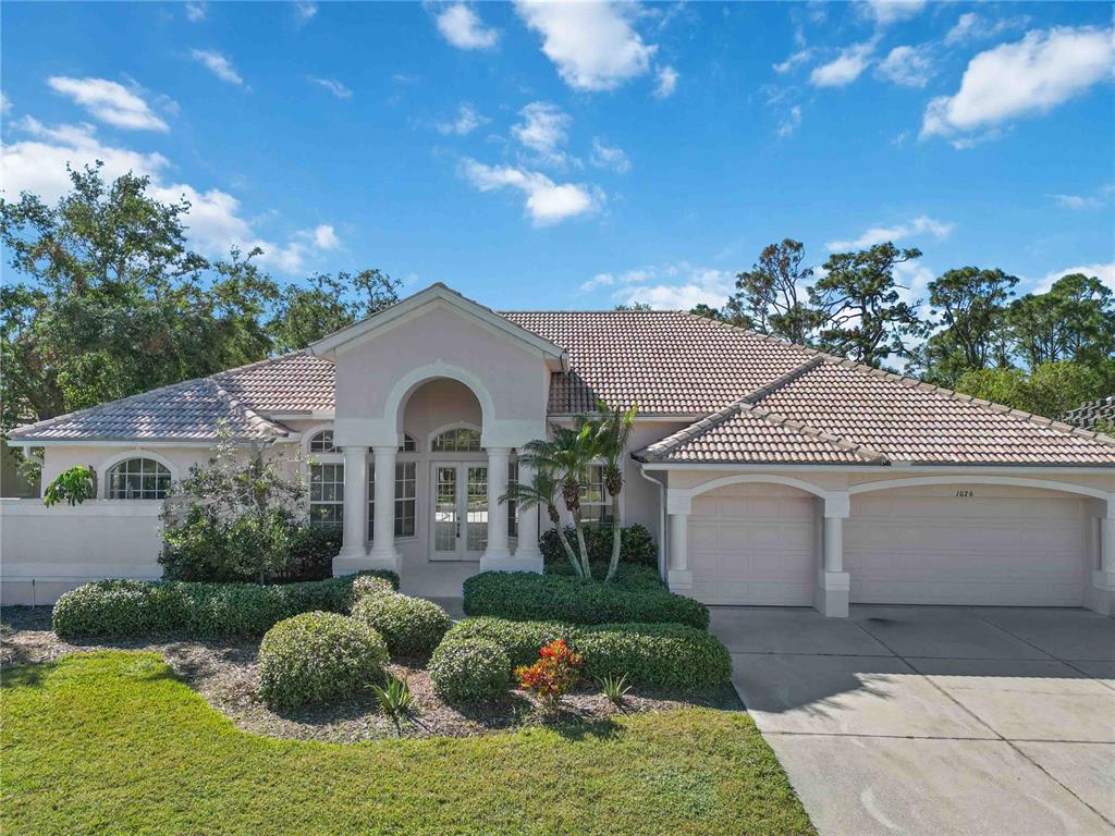 a front view of a house with garden