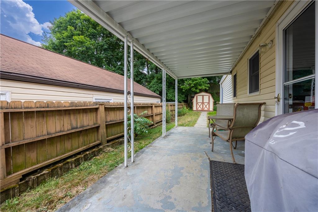 a view of backyard with patio