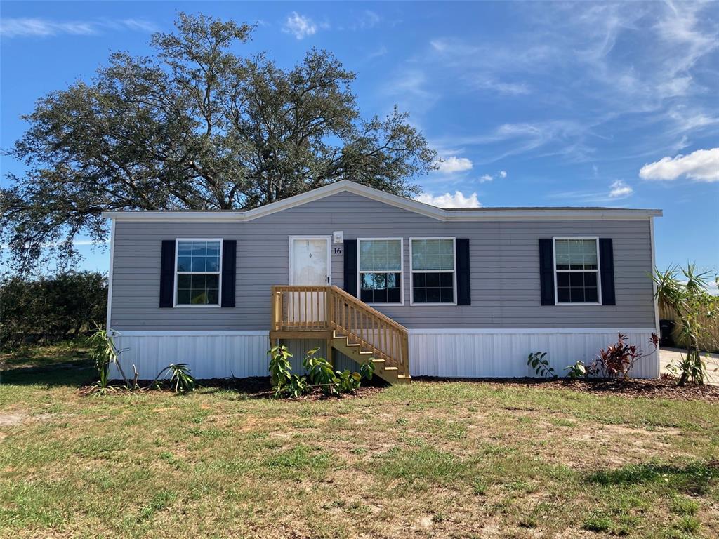 a house with trees in the background