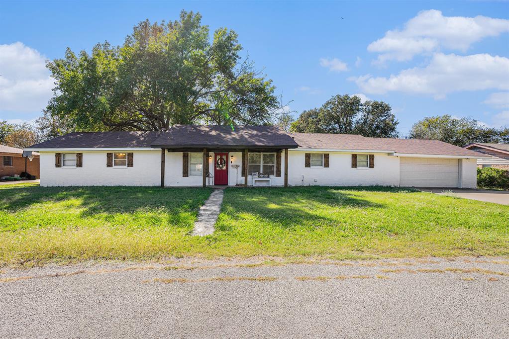 front view of a house next to a yard